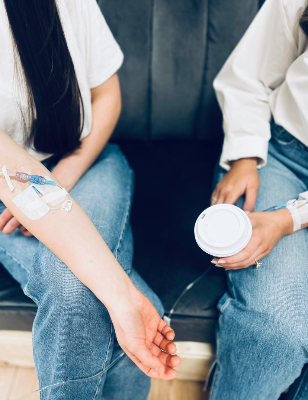 Two friends enjoying coffee together during an IV infusion