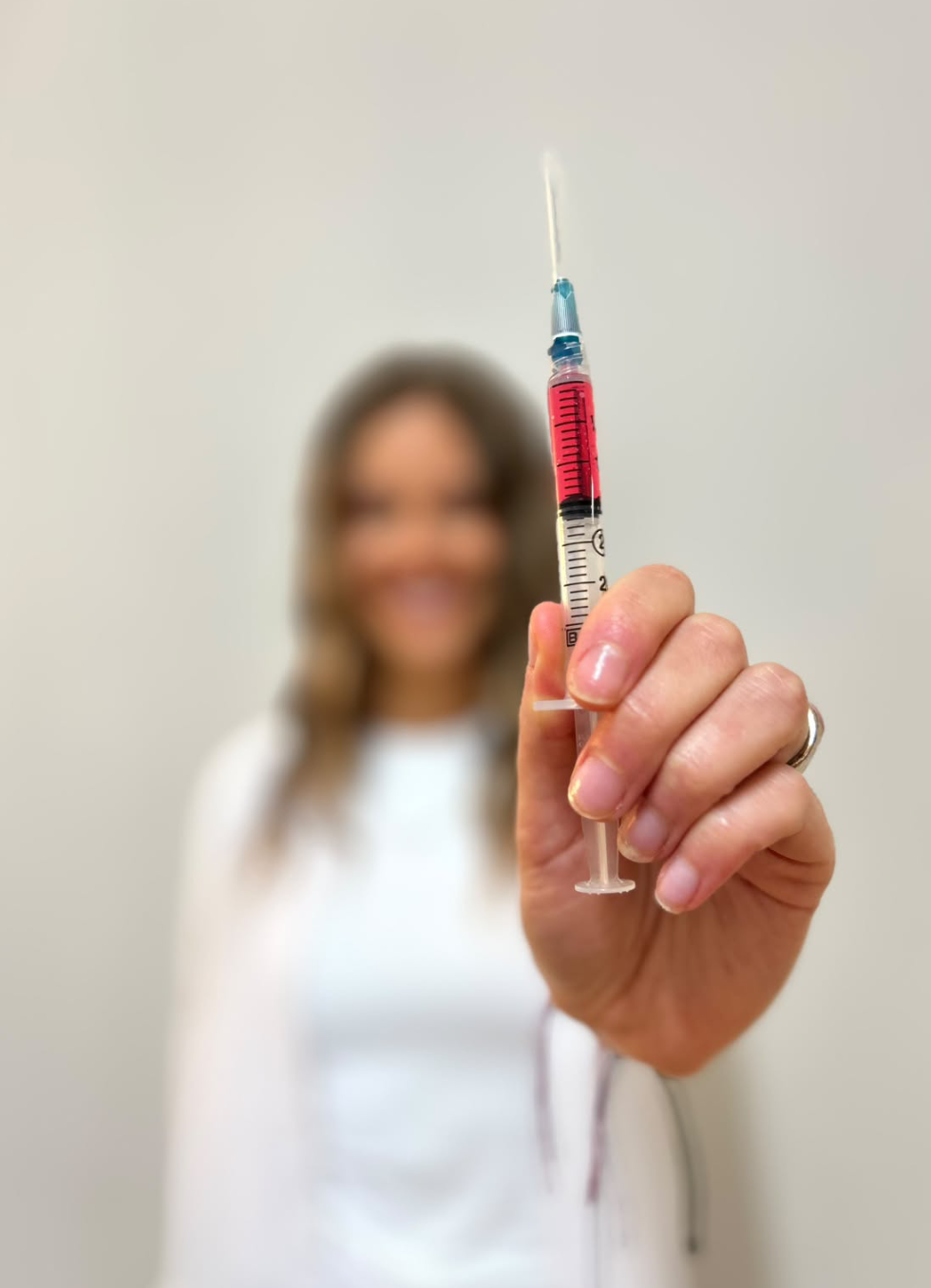 Katie holding a prepared B12 injection